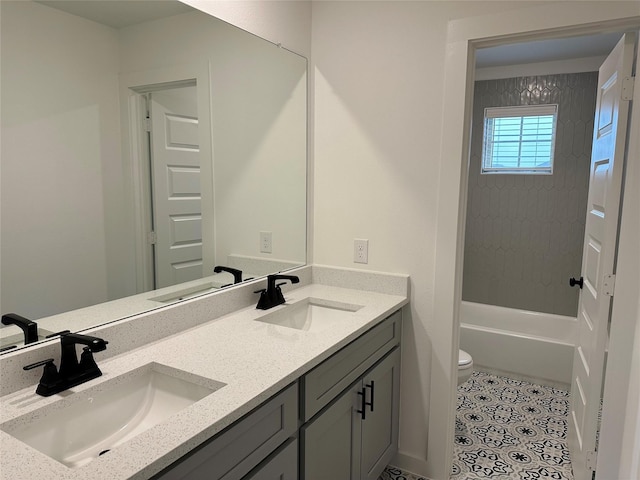 bathroom featuring tile patterned flooring, vanity, and toilet