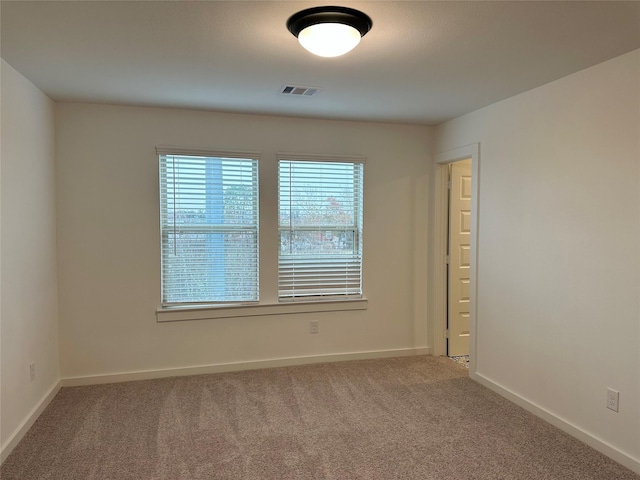 empty room featuring carpet flooring