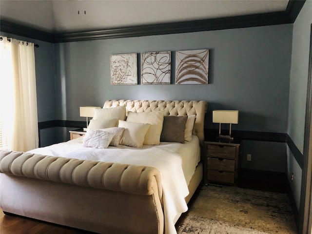 bedroom with ornamental molding, multiple windows, and dark wood-type flooring