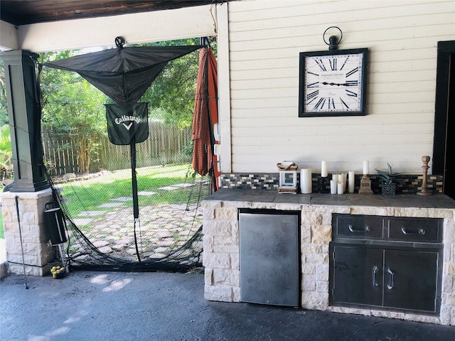 view of patio featuring exterior kitchen