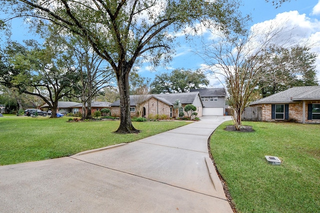 single story home with a front yard and a garage