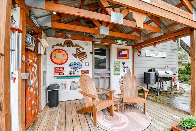 wooden deck featuring area for grilling