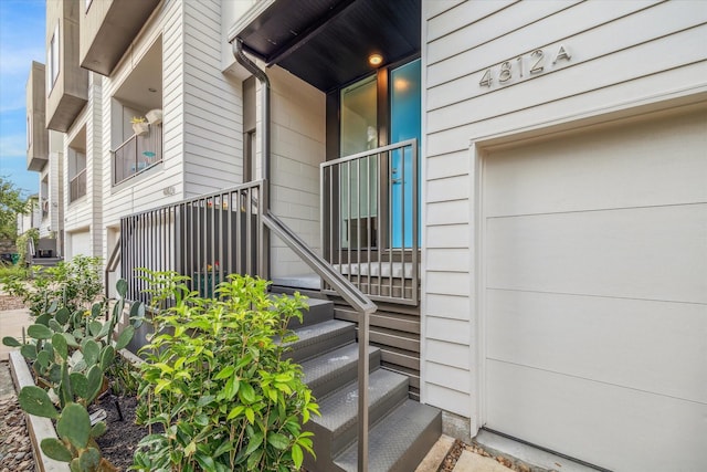 doorway to property featuring a garage