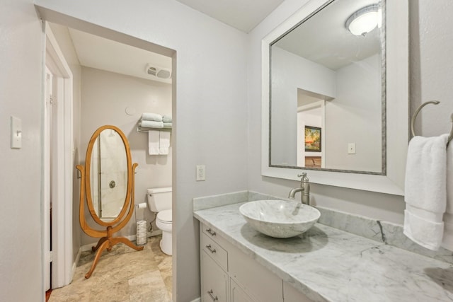 bathroom with vanity and toilet