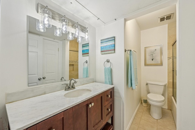 full bathroom with tile patterned floors, vanity, toilet, and shower / bath combination with glass door