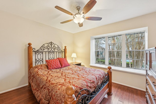 bedroom featuring dark hardwood / wood-style floors and ceiling fan