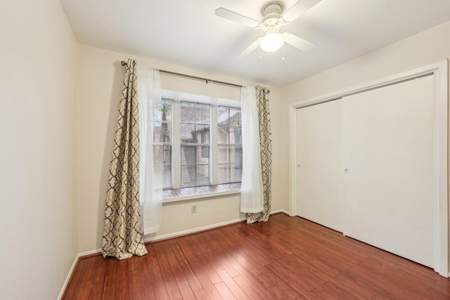 unfurnished bedroom with a closet, ceiling fan, and hardwood / wood-style flooring