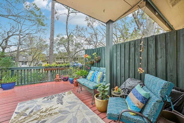 wooden terrace with outdoor lounge area