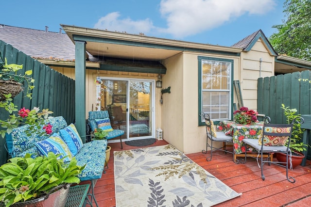 entrance to property with a wooden deck