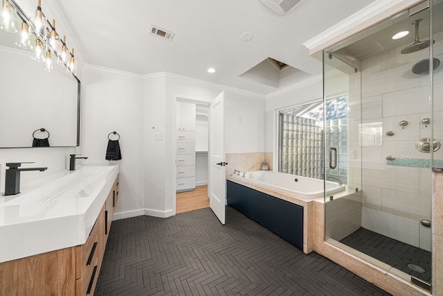 bathroom featuring independent shower and bath, crown molding, and vanity