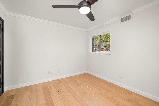 unfurnished room with ceiling fan, wood-type flooring, and crown molding