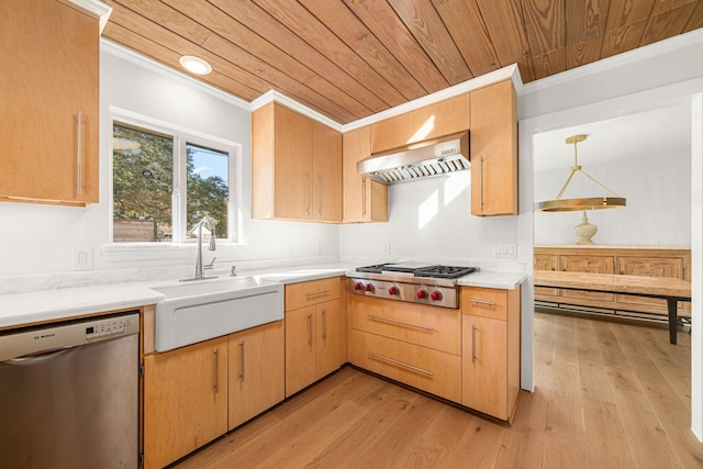 kitchen featuring stainless steel appliances, light brown cabinets, hanging light fixtures, range hood, and sink