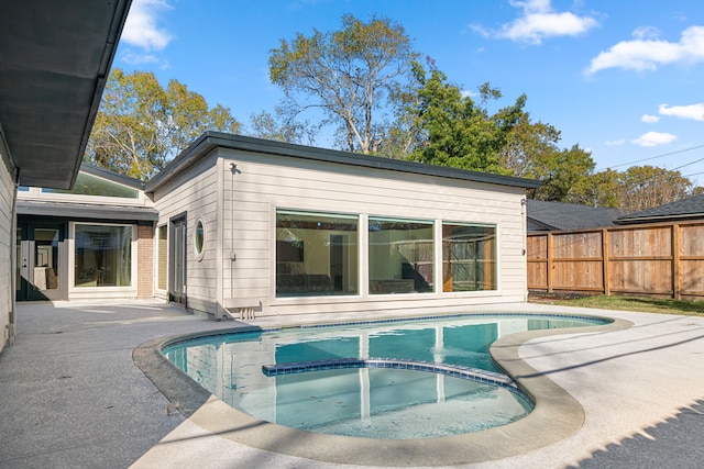 view of pool featuring an in ground hot tub and a patio