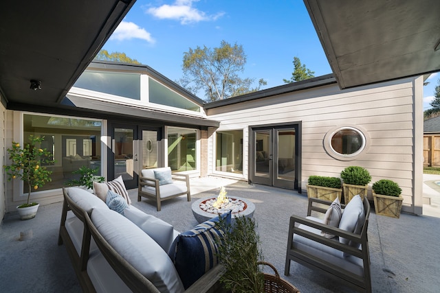 view of patio / terrace featuring an outdoor living space with a fire pit