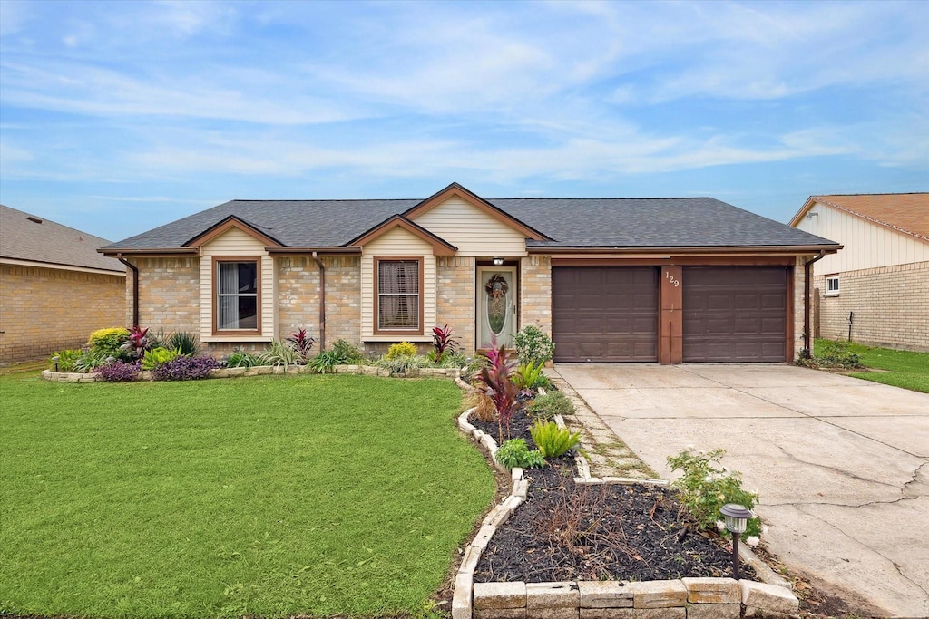 single story home with a garage and a front yard