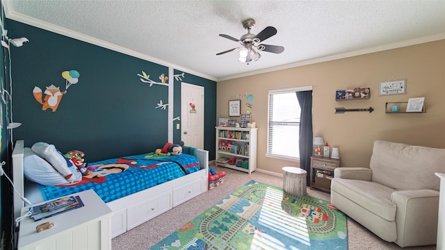 carpeted bedroom featuring a textured ceiling, ceiling fan, and ornamental molding