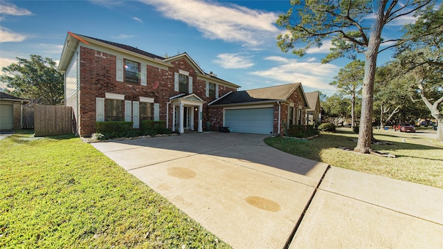 view of front of home featuring a garage and a front lawn