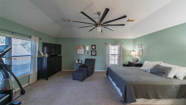 bedroom with a textured ceiling, ceiling fan, carpet, and lofted ceiling