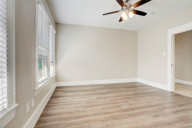 spare room featuring ceiling fan and light wood-type flooring