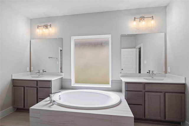 bathroom featuring tile patterned flooring, vanity, and independent shower and bath