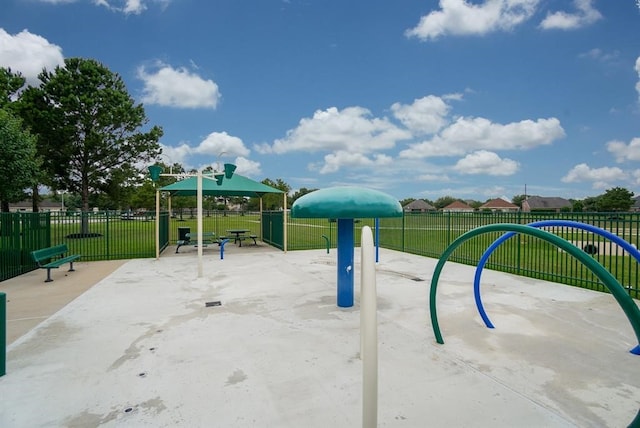 view of property's community featuring a lawn and a playground