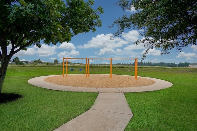 view of play area featuring a lawn