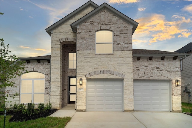 french provincial home with a garage