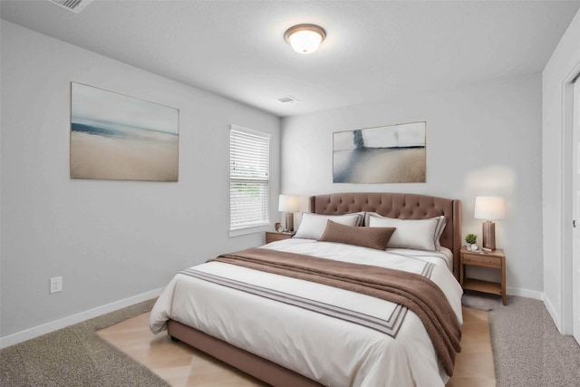 bedroom with light colored carpet