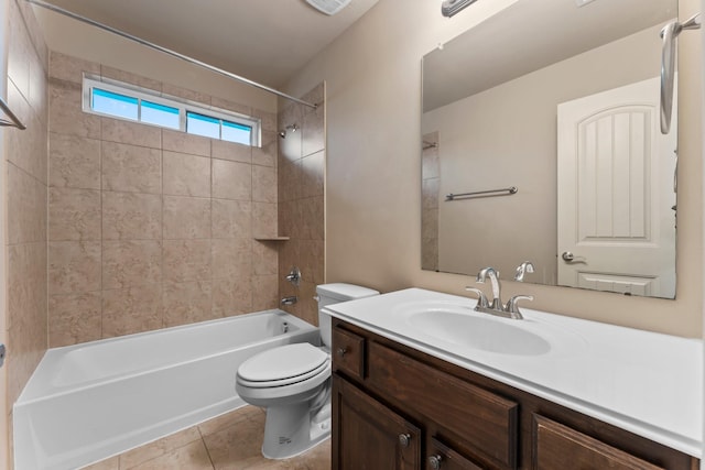 full bathroom with vanity, tile patterned floors, toilet, and tiled shower / bath