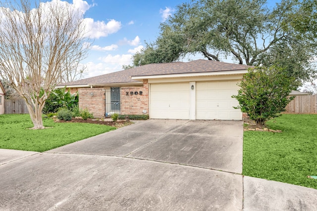 single story home featuring a garage and a front yard