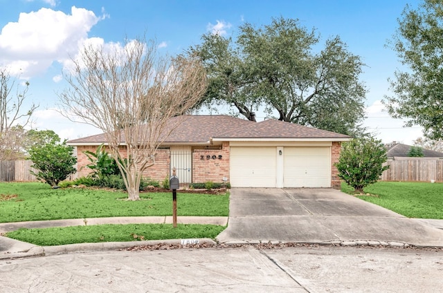 single story home with a front lawn and a garage