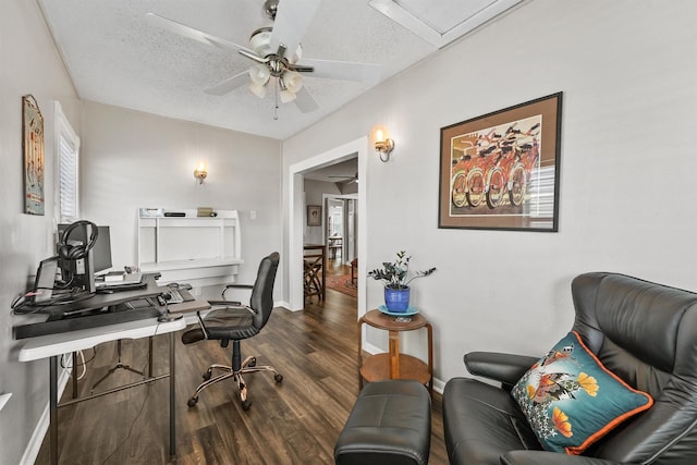 home office featuring a textured ceiling, dark hardwood / wood-style floors, and ceiling fan