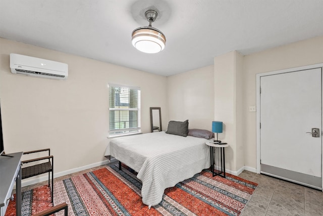 bedroom featuring an AC wall unit