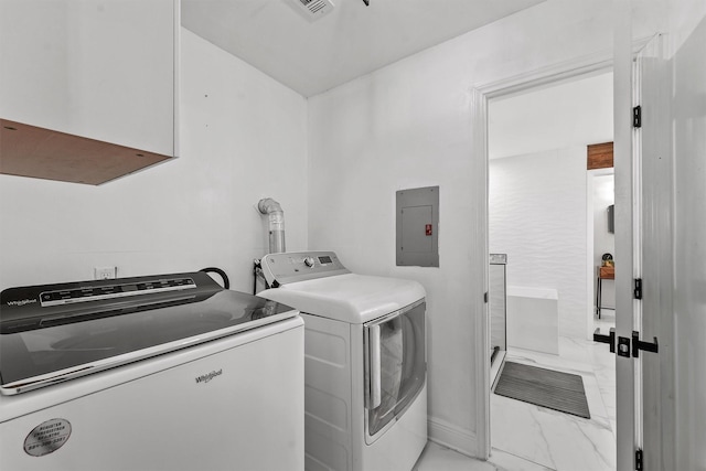 laundry area featuring washing machine and dryer and electric panel