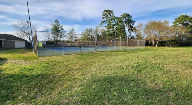 view of yard featuring tennis court