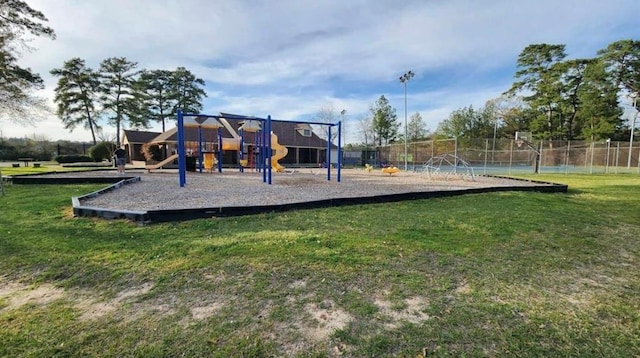 view of playground featuring a lawn