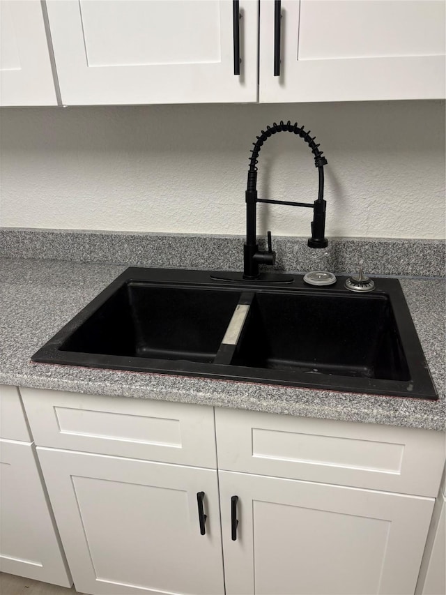 room details with sink and white cabinets