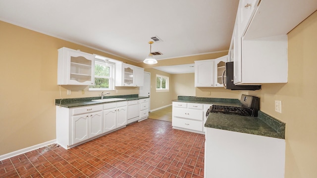 kitchen with black range oven, white cabinets, hanging light fixtures, and white dishwasher