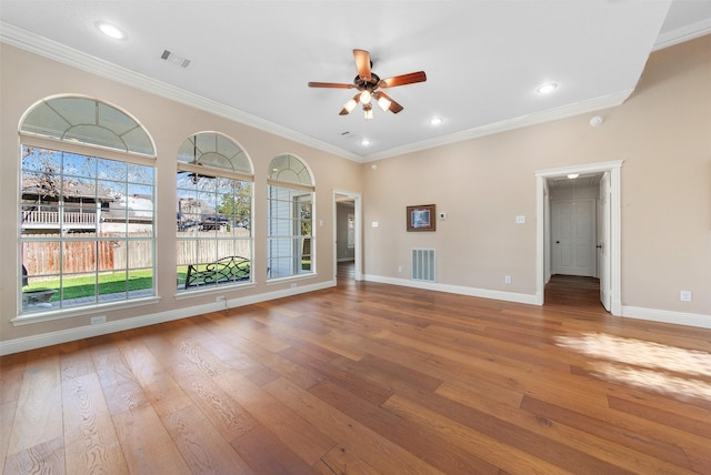 unfurnished living room with ceiling fan, hardwood / wood-style floors, and ornamental molding