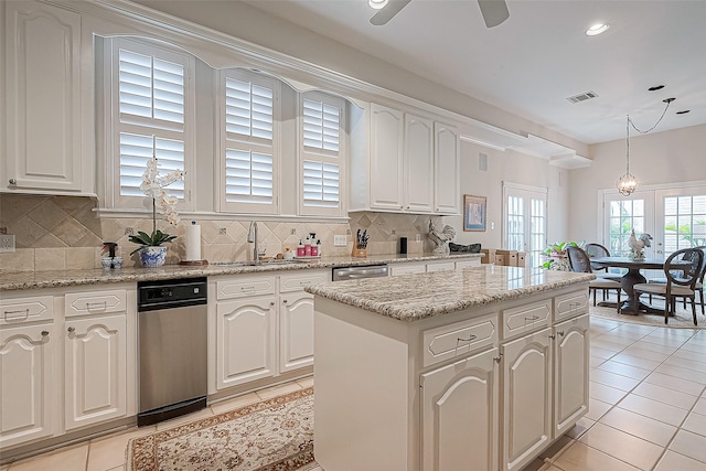 kitchen featuring white cabinetry, a kitchen island, and pendant lighting