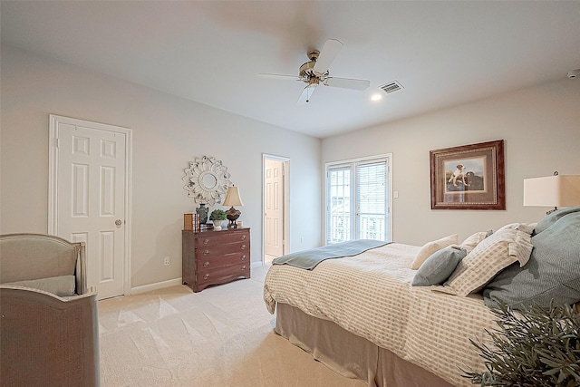 bedroom with ceiling fan and light colored carpet