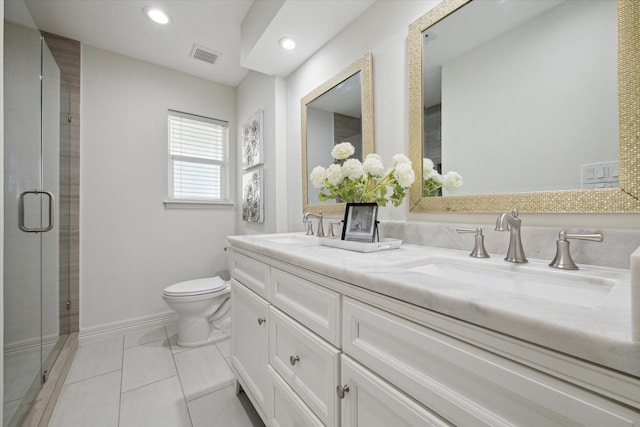 bathroom featuring tile patterned floors, a shower with door, vanity, and toilet