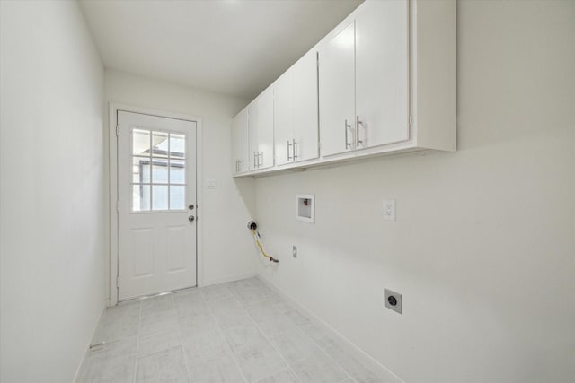 washroom with hookup for an electric dryer, hookup for a gas dryer, cabinets, and washer hookup