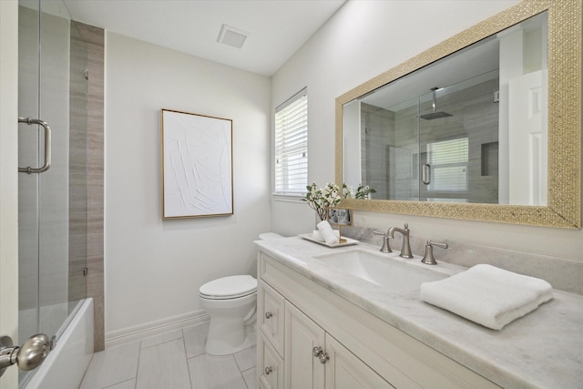 bathroom with toilet, vanity, tile patterned floors, and an enclosed shower