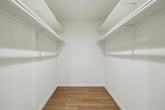 spacious closet featuring hardwood / wood-style floors