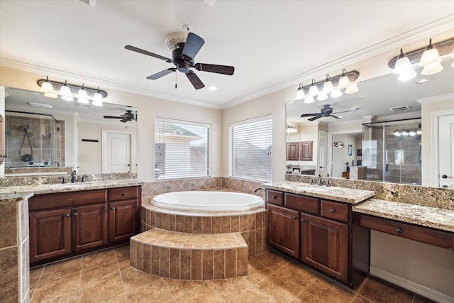 bathroom with vanity, crown molding, and independent shower and bath