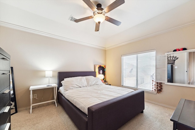 bedroom featuring light colored carpet, ceiling fan, and ornamental molding