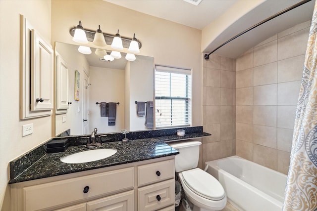 full bathroom with vanity, toilet, and shower / bath combo with shower curtain