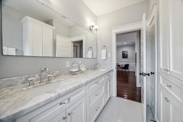 bathroom with tile patterned flooring and vanity