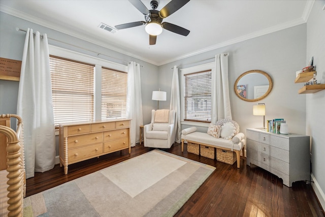 sitting room featuring ornamental molding, dark wood-type flooring, and ceiling fan